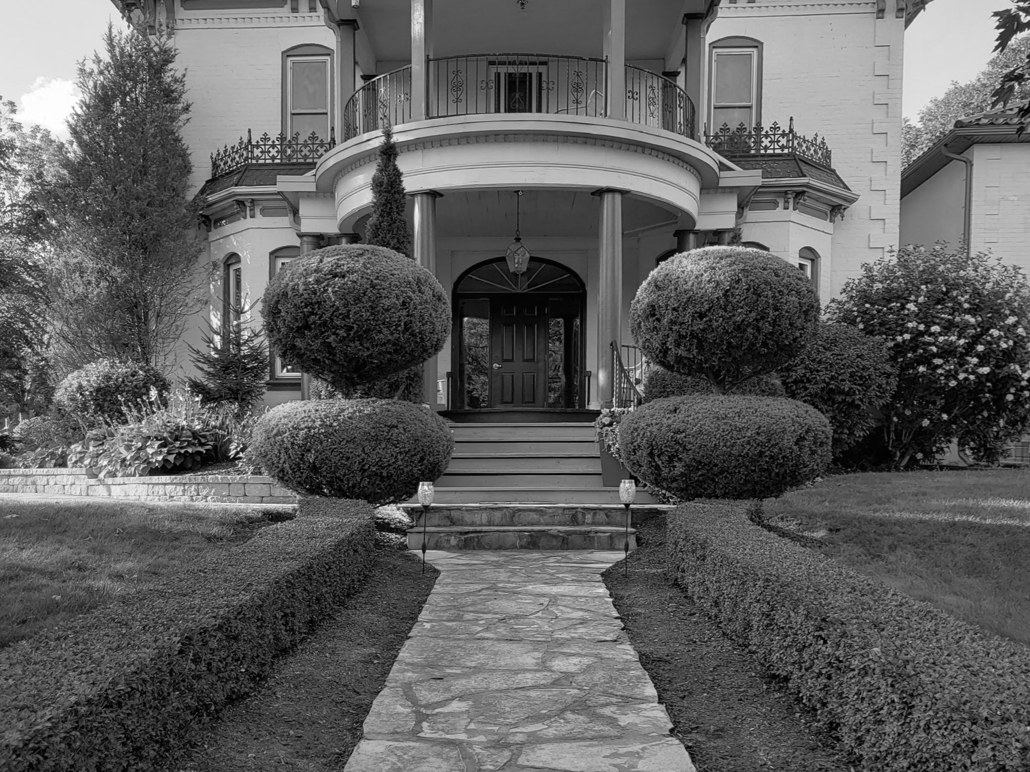 black and white grand entrance to a house 